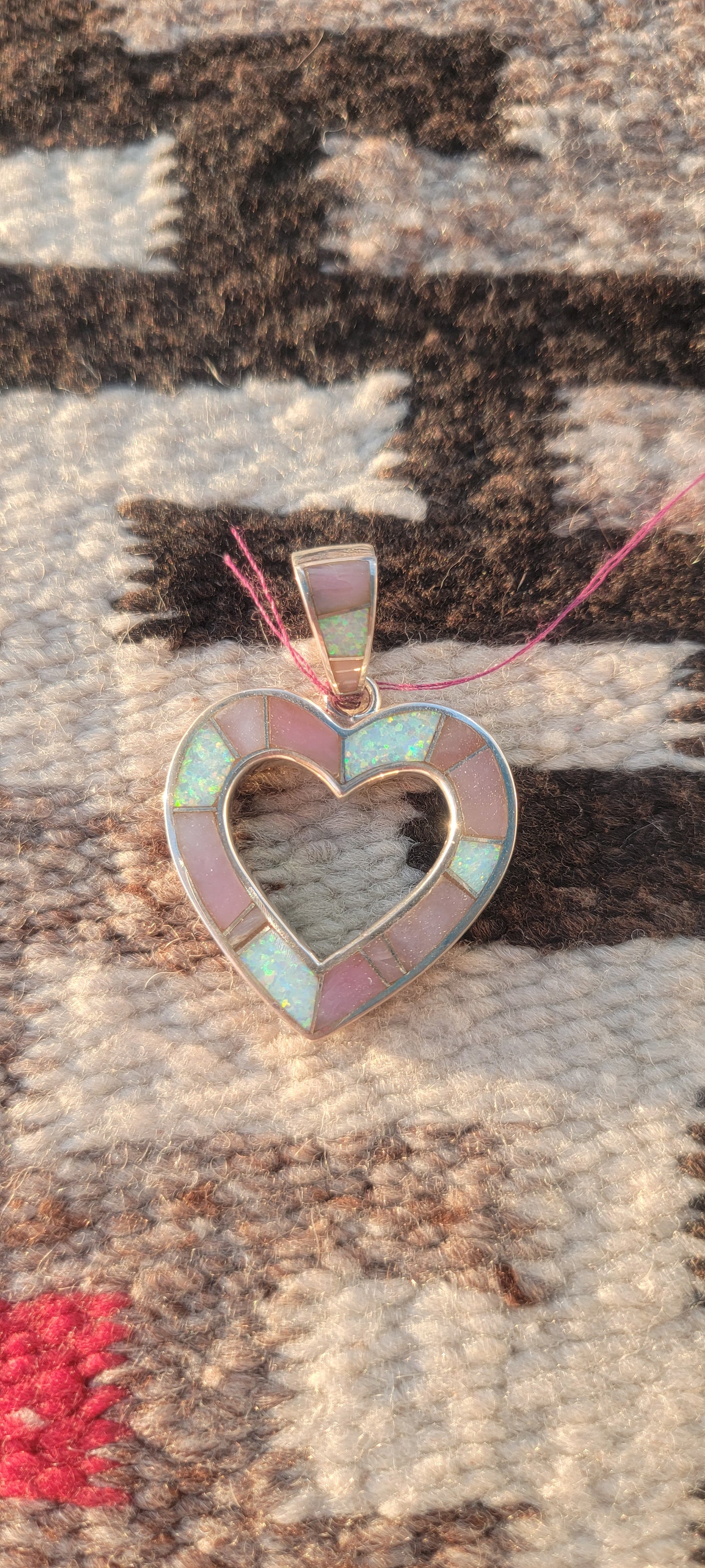 Heart set in silver pink and white opal