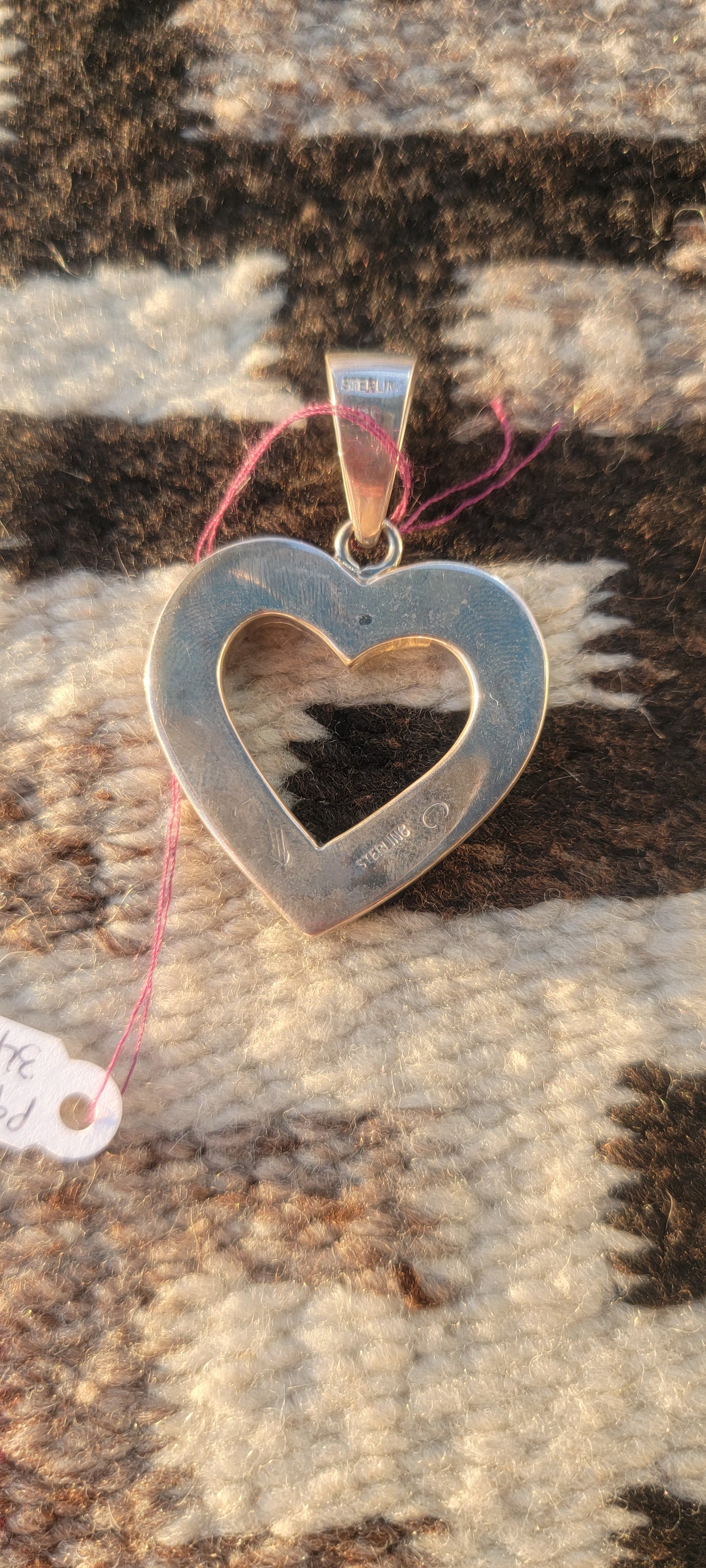 Heart set in silver pink and white opal