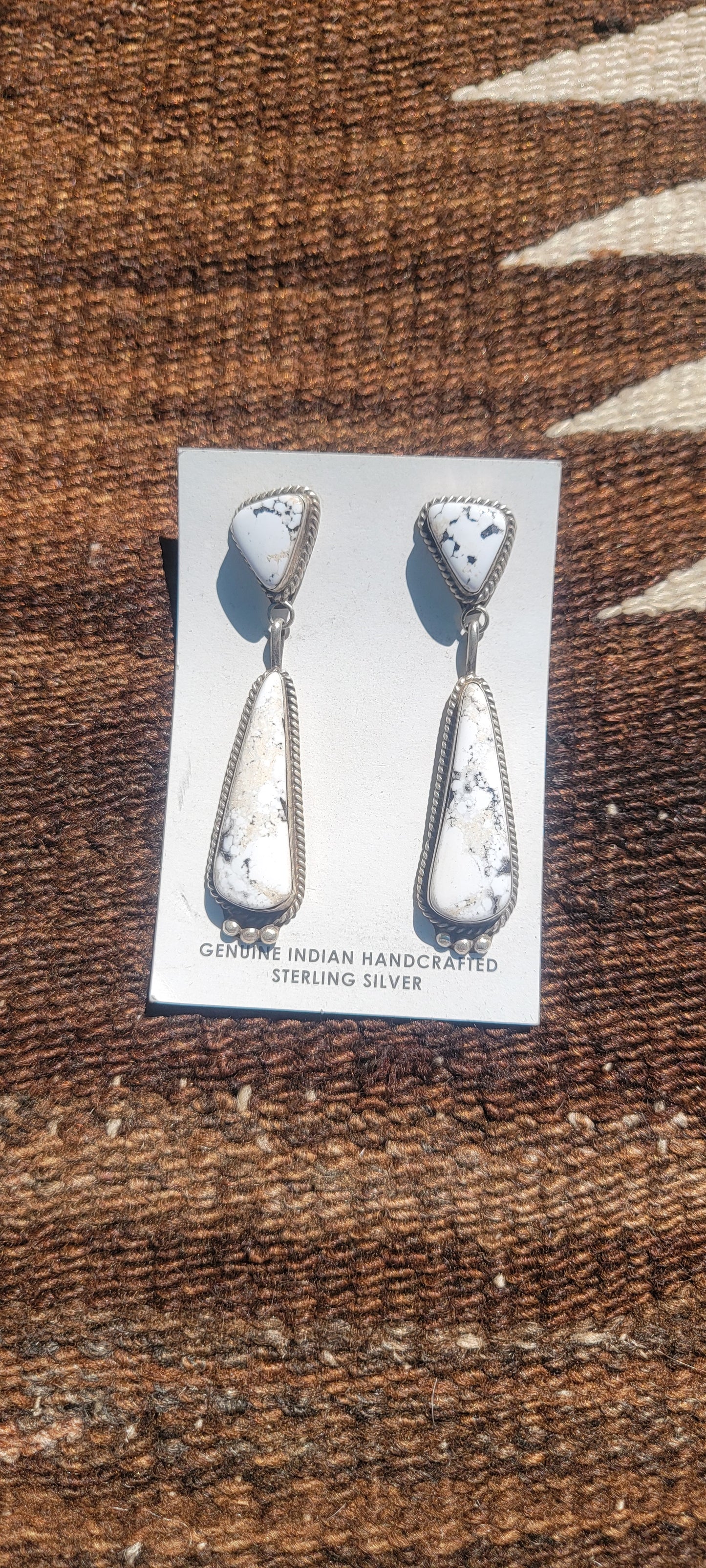 White Buffalo set in sterling silver statement earrings