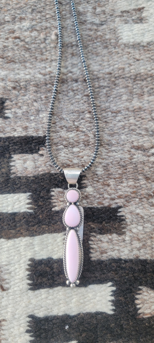 Pink conch shell pendant on Navajo Pearl chain